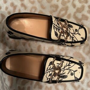 White with black embroidered flowers and gold buckle size 8